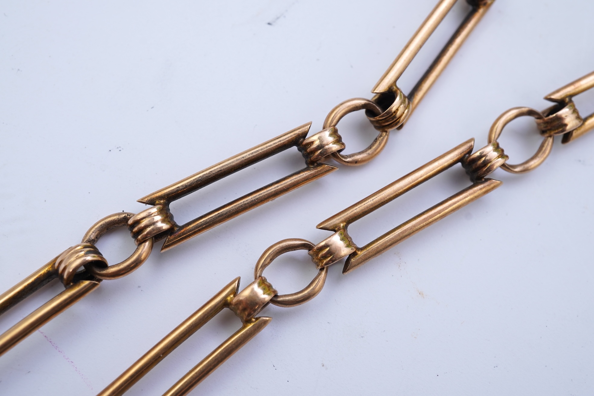 A continental 18k gold open faced keyless lever pocket watch, with a 9ct albert